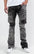 Black camo Extended length flare pant with a regular rise for maximum stacks. Skinny fit with hand-smearing and speckled paint splatter throughout. Rip and repair detailing, accompanied by cut & sewn woodland camouflage twill patches. Stitching repairs and deep front pocket bags, perfect for large smart phones.