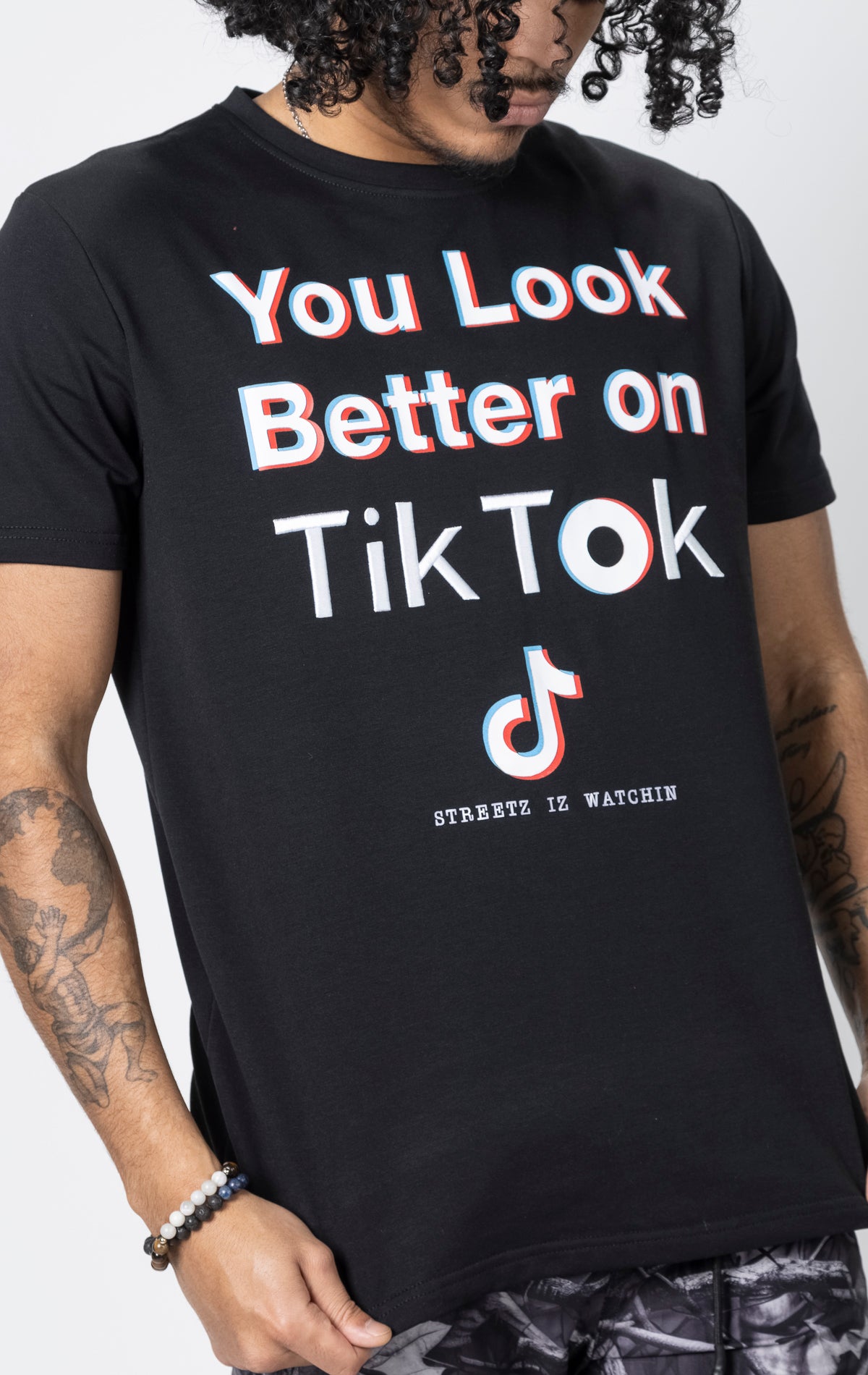 Black t-shirt with "You Look Better on TikTok" graphic.