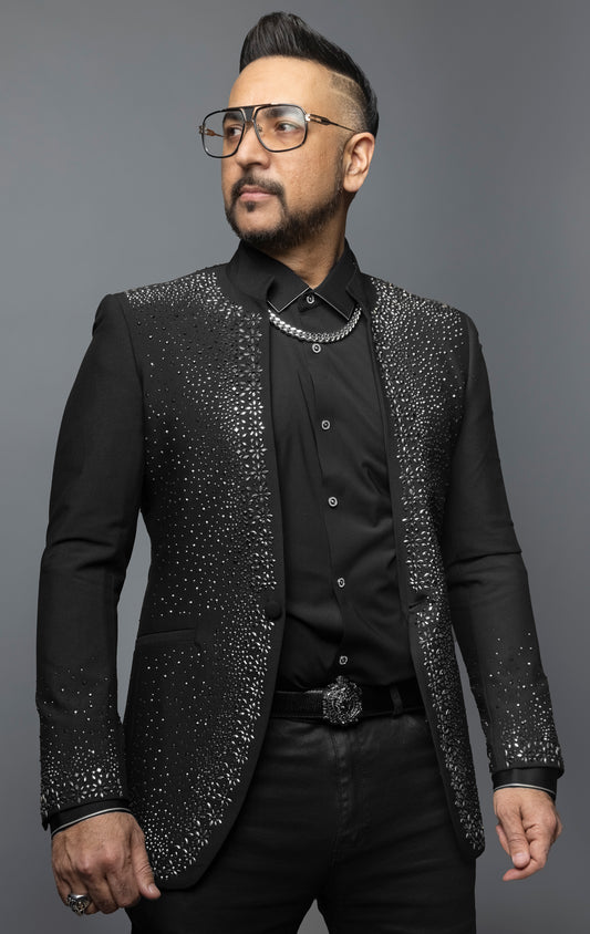 Embellished blazer with a dazzling interplay of light and texture, perfect for special occasions, showcasing opulence and style.