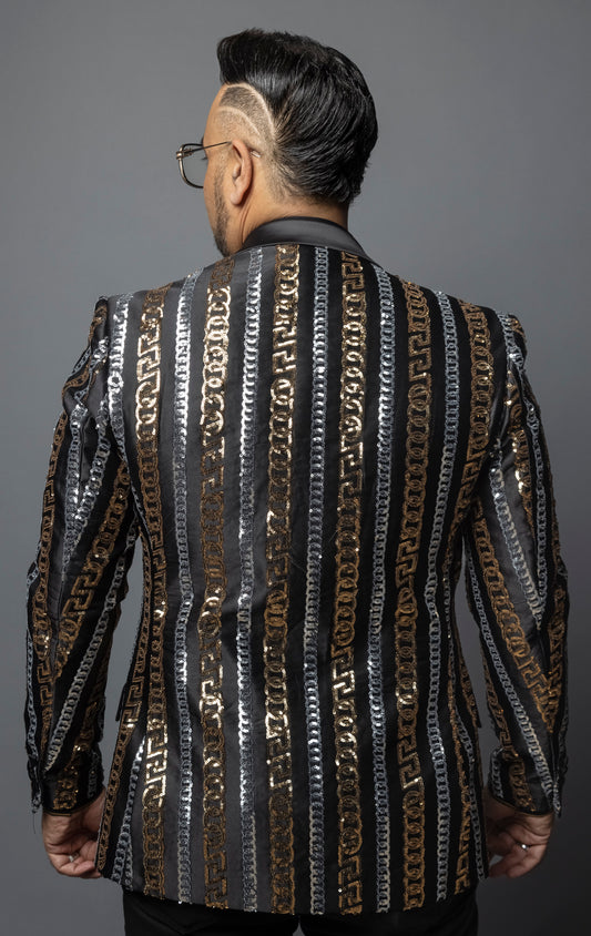 Men's slim-fit blazer with a satin notch lapel, long sleeves, and two-button closure. The blazer features a unique pattern combining Cuban chain, Greek key, and sequin designs. Made from 100% regenerated fiber.