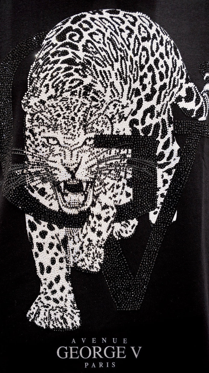 Leopard head design made of rhinestones on a black background with 'Avenue George V Paris' text.