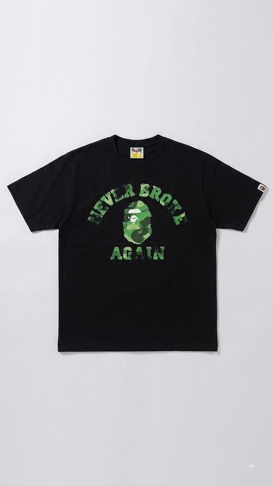 A black short-sleeve t-shirt featuring a green camouflage graphic of the A Bathing Ape head on the chest, with the text 'NEVER BROKE AGAIN' in green above and below it. The shirt is displayed flat against a light gray background.