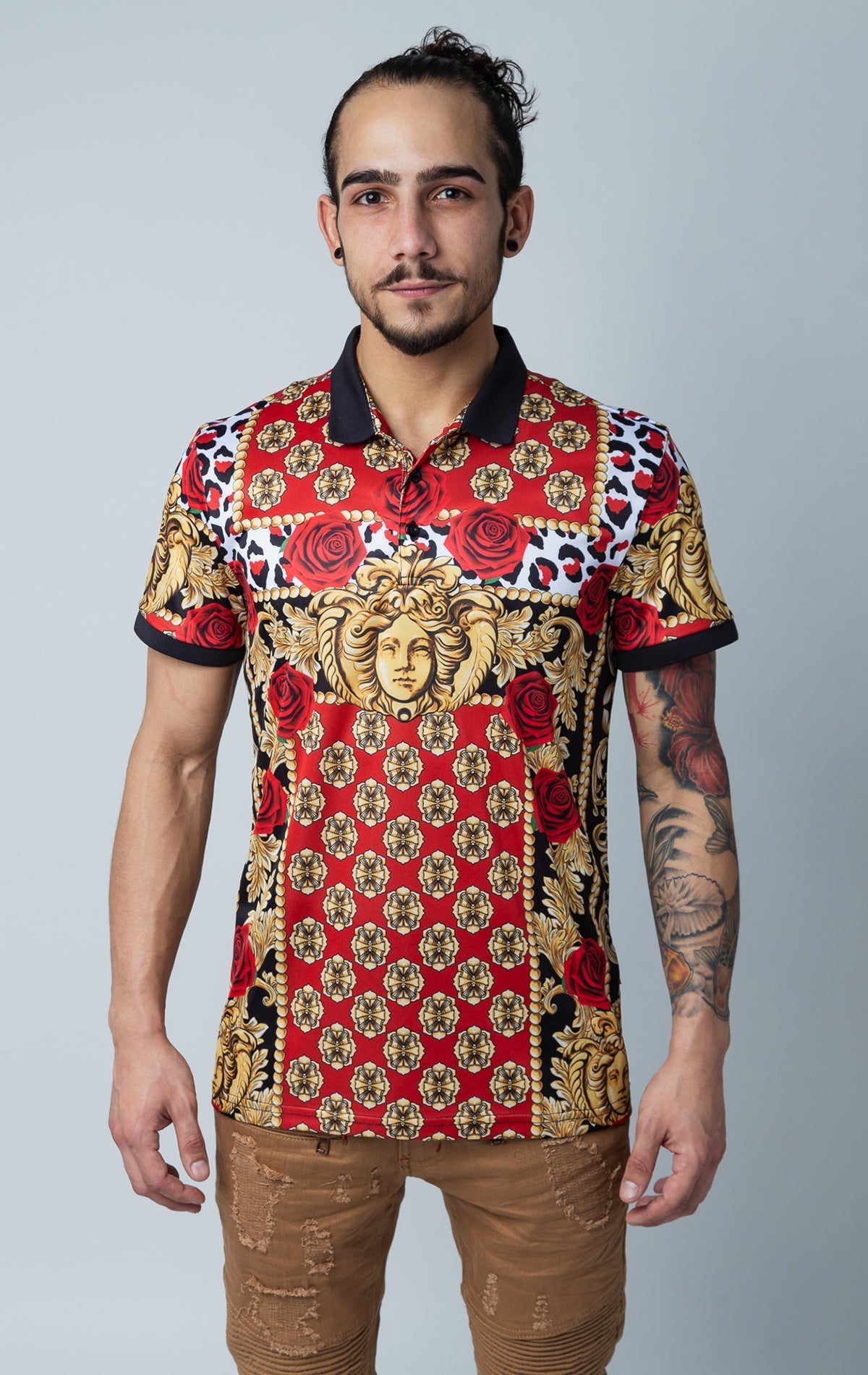 Graphic print collared short sleeve shirt with three front button fastenings.