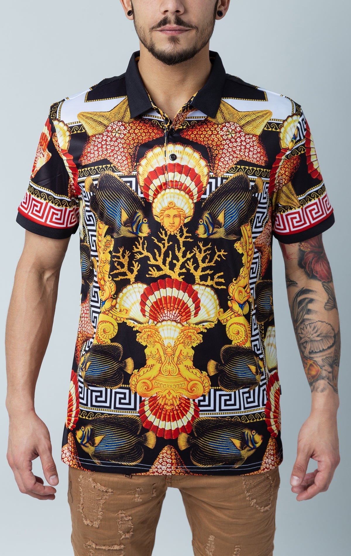 Men's short-sleeve polo shirt with Medusa, Greek key, fishes, and ocean print, featuring a contrasting royal collar and three-button closure.