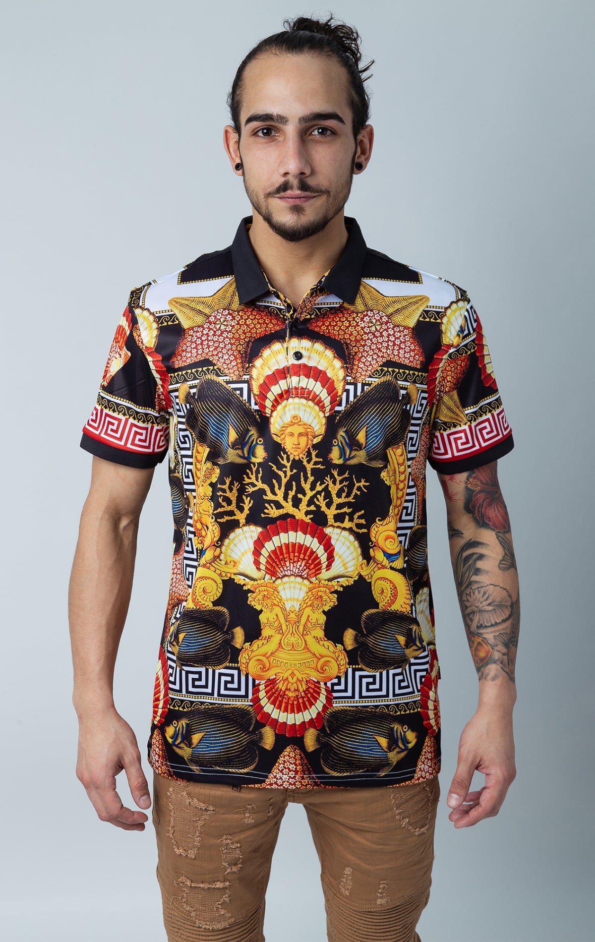 Men's short-sleeve polo shirt with Medusa, Greek key, fishes, and ocean print, featuring a contrasting royal collar and three-button closure.