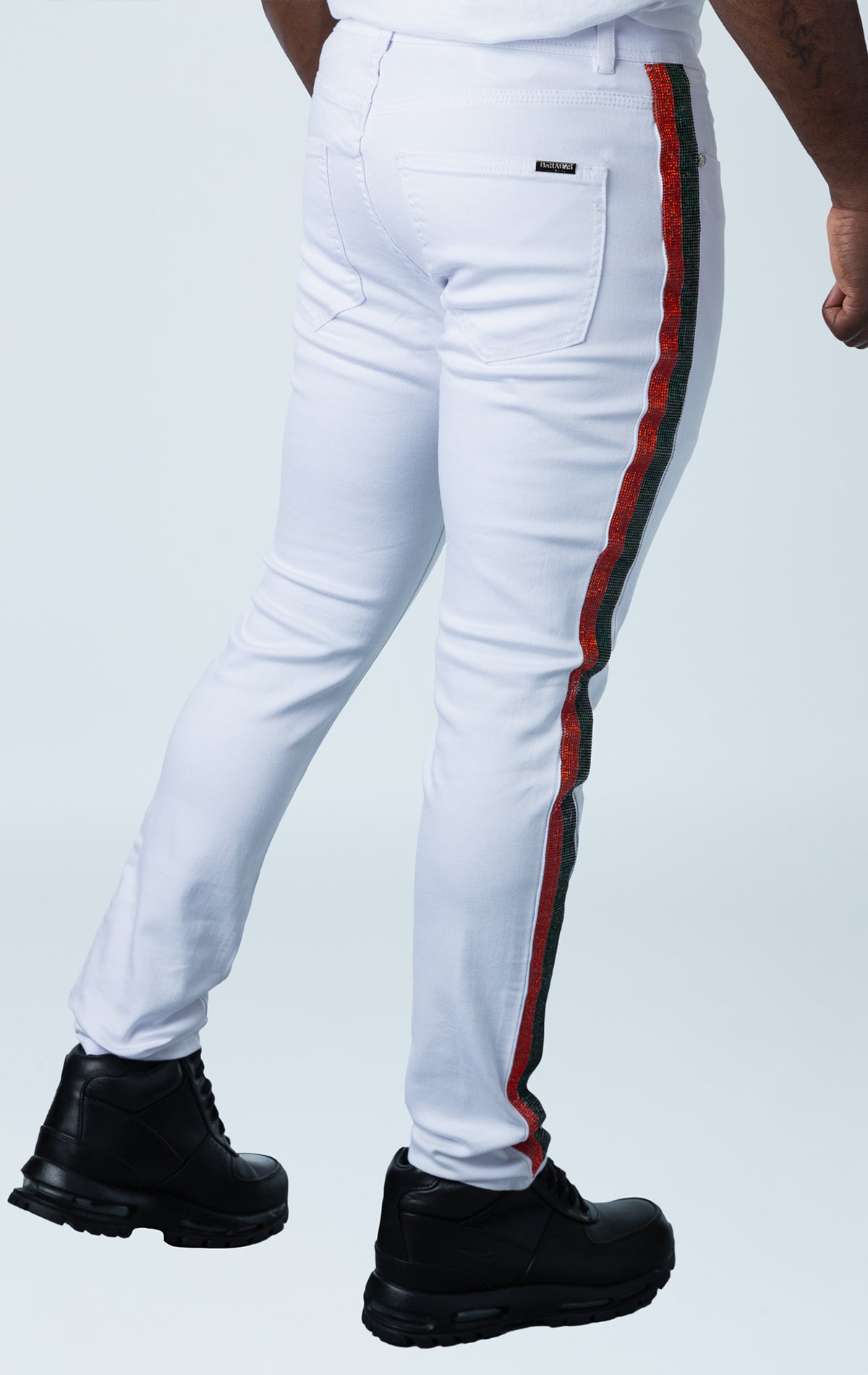 White premium denim pants with unique side strip design.