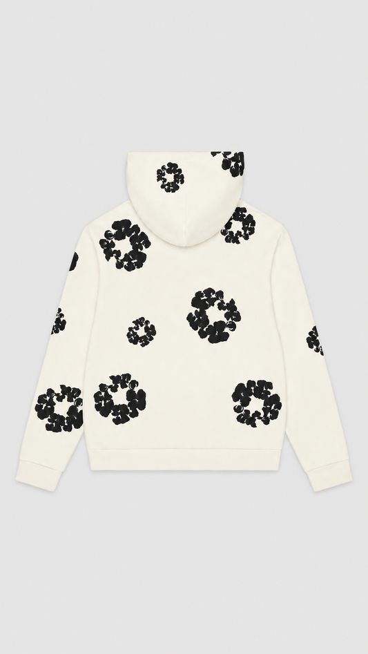 An off-white hooded sweatshirt with black circular floral patterns, shown from the back against a light gray background.