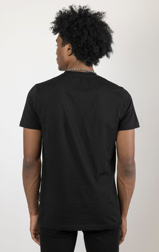 Black Men's regular fit t-shirt in a variety of colors. The shirt features a slightly elongated sleeve, a fitted neckline, and a straight body. It has a "Temptation" front print with 3D embroidery. Made from 100% cotton jersey (190gsm). A "blessed" slogan is printed on the inner neck binding and a woven side seam tab with "blessed" is also included.