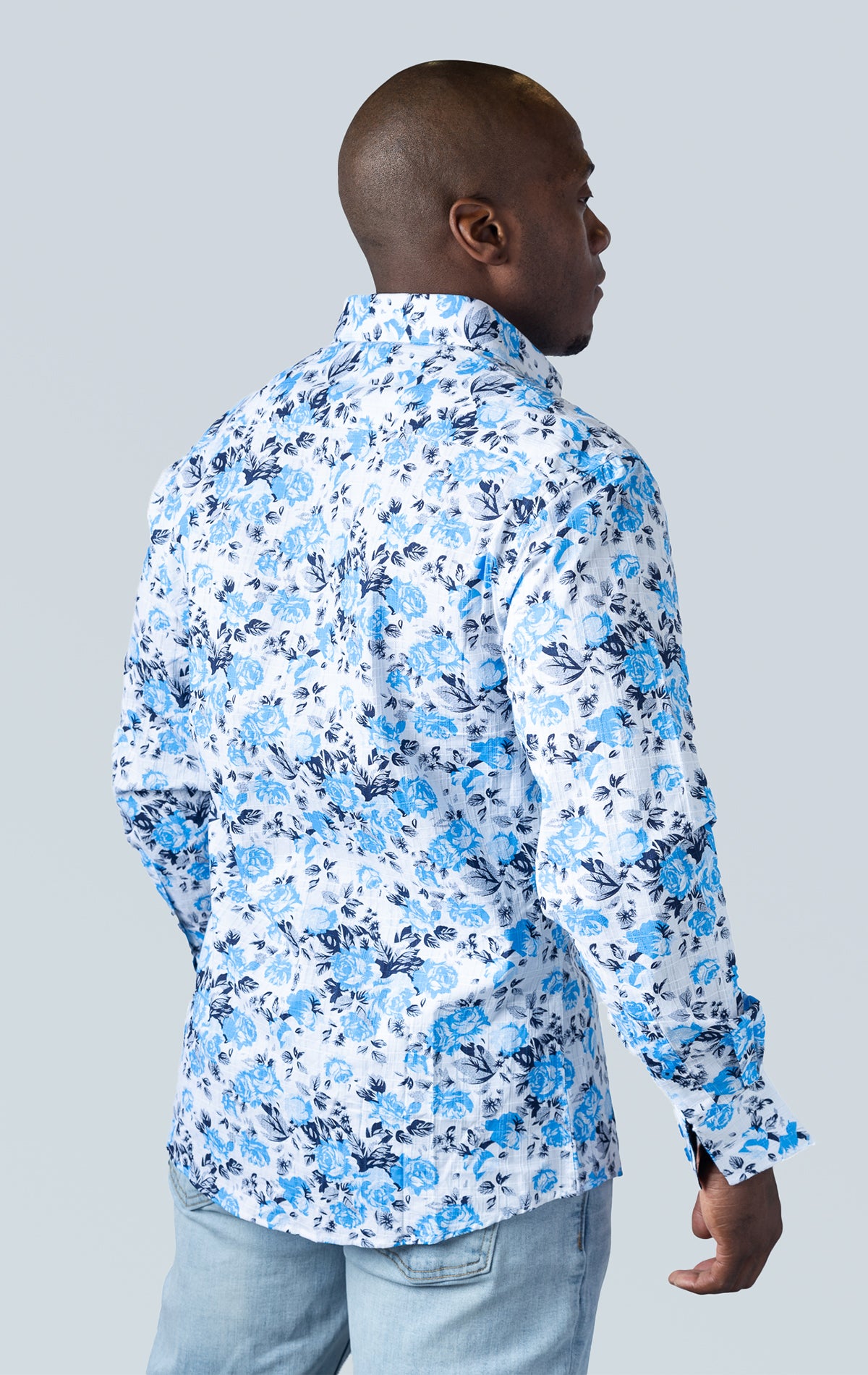 White long sleeve button up dress shirt with blue floral pattern