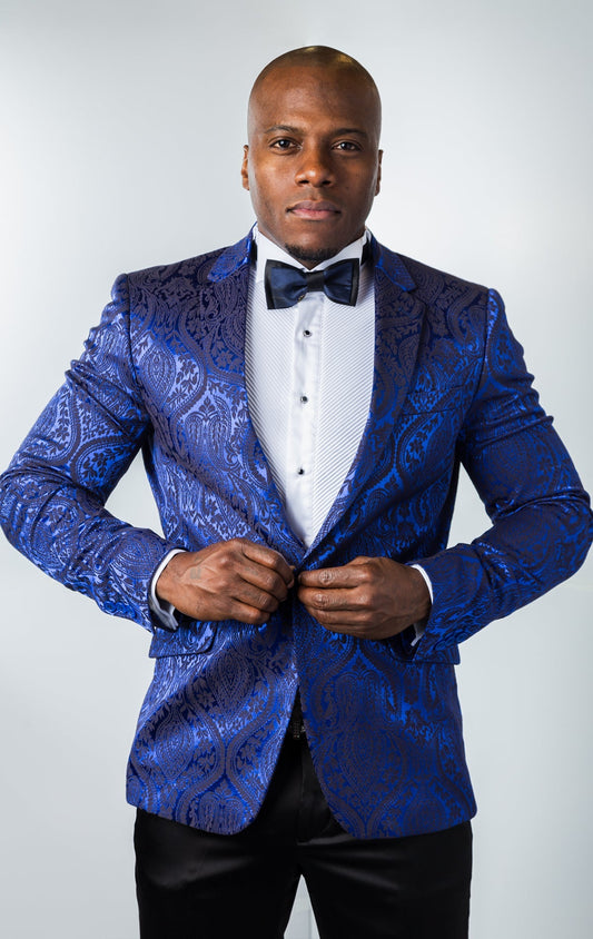 Men's slim-fit blazer in navy. The blazer features a paisley patterned poly fabric, peak lapels, one-button closure, and double side vents. 