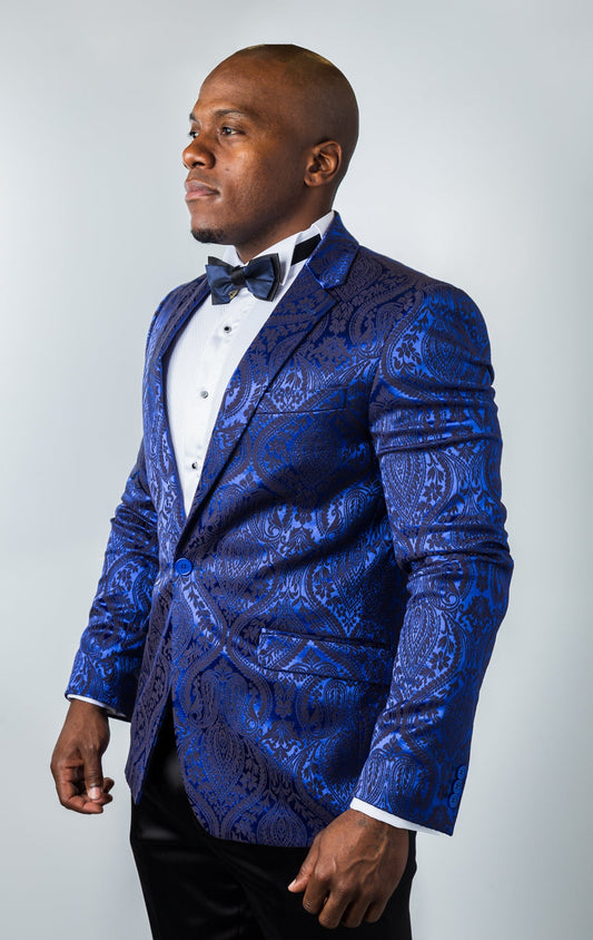 Men's slim-fit blazer in navy. The blazer features a paisley patterned poly fabric, peak lapels, one-button closure, and double side vents. 