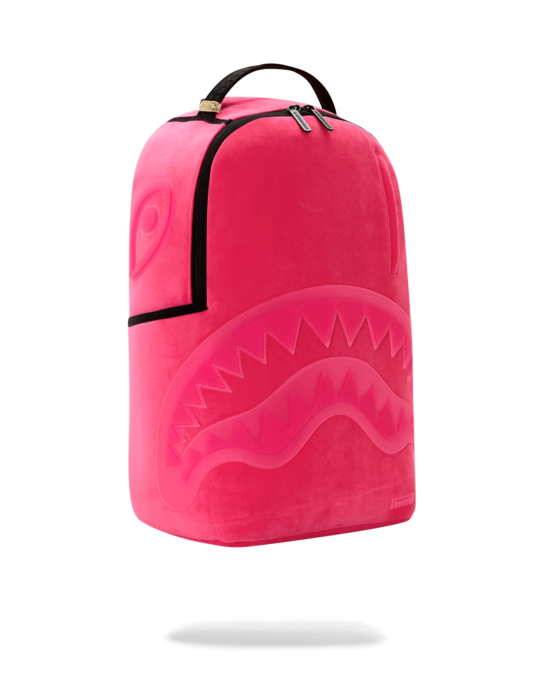 A bright pink backpack with a shark-face graphic design, featuring black trim and a top handle, shown against a plain white background.