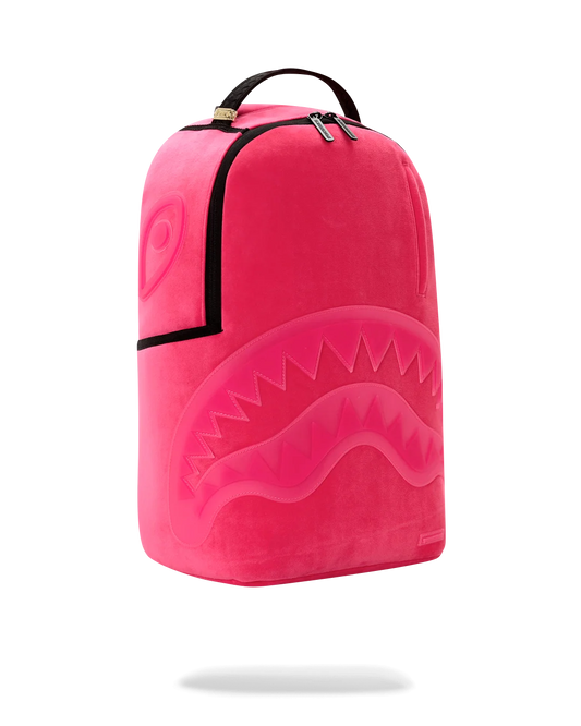 A bright pink backpack with a shark-face graphic design, featuring black trim and a top handle, shown against a plain white background.
