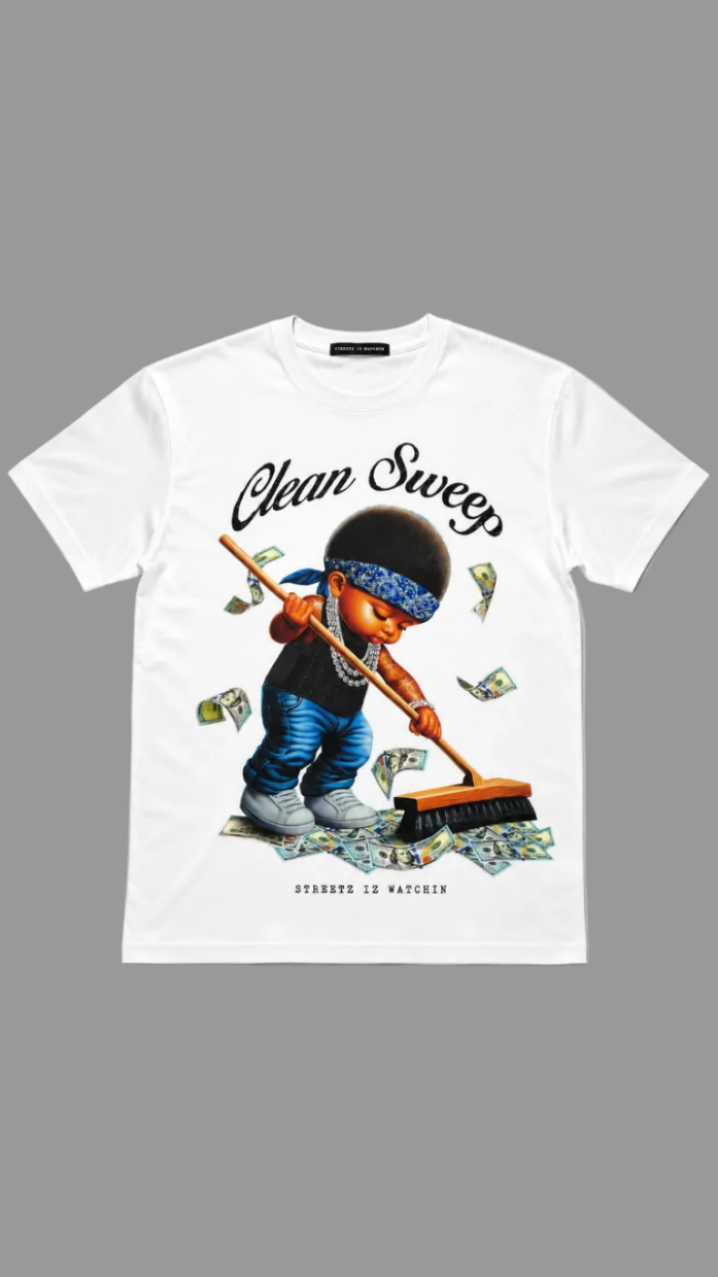 A white short-sleeve graphic T-shirt laid flat against a neutral gray background. The shirt features a large front print of a cartoon character sweeping money with a broom, with the words 'Clean Sweep' 
