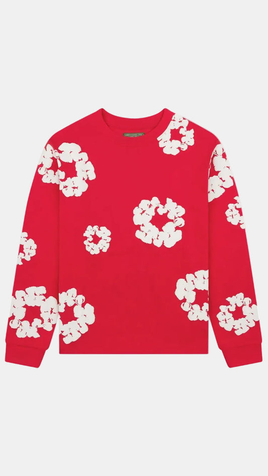 A red crewneck sweatshirt with a white abstract floral pattern, displayed flat against a light gray background.