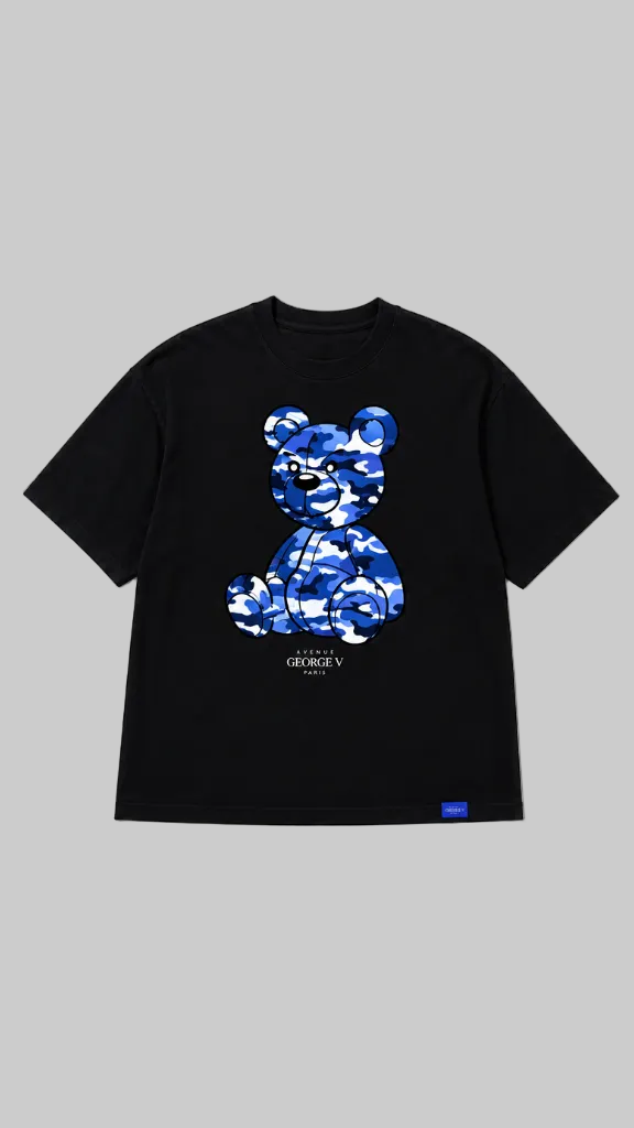 Front view of a black short-sleeve t-shirt. The front features a large blue camouflage graphic of a teddy bear 