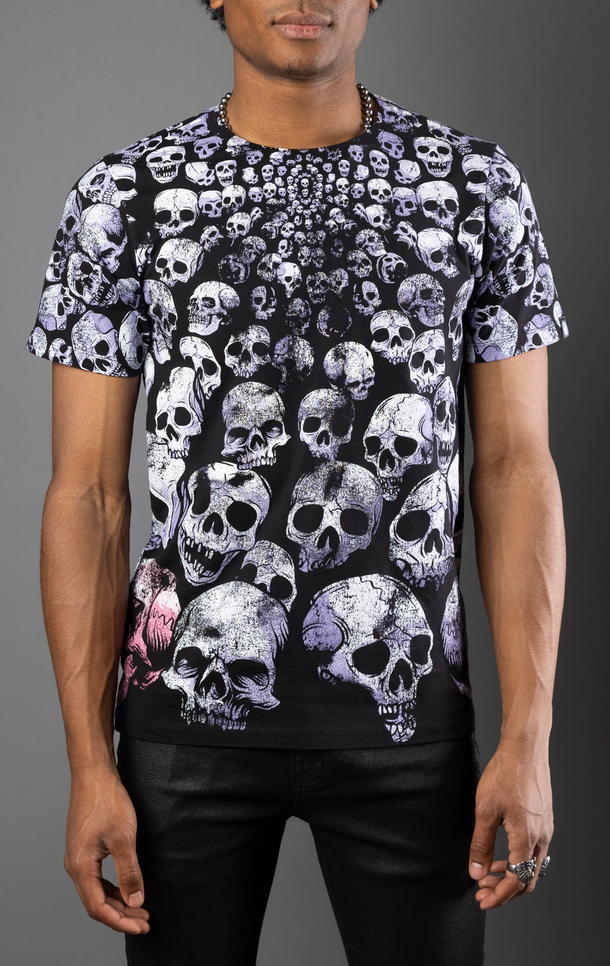 Black cotton tee with distressed all-over repeat skull print