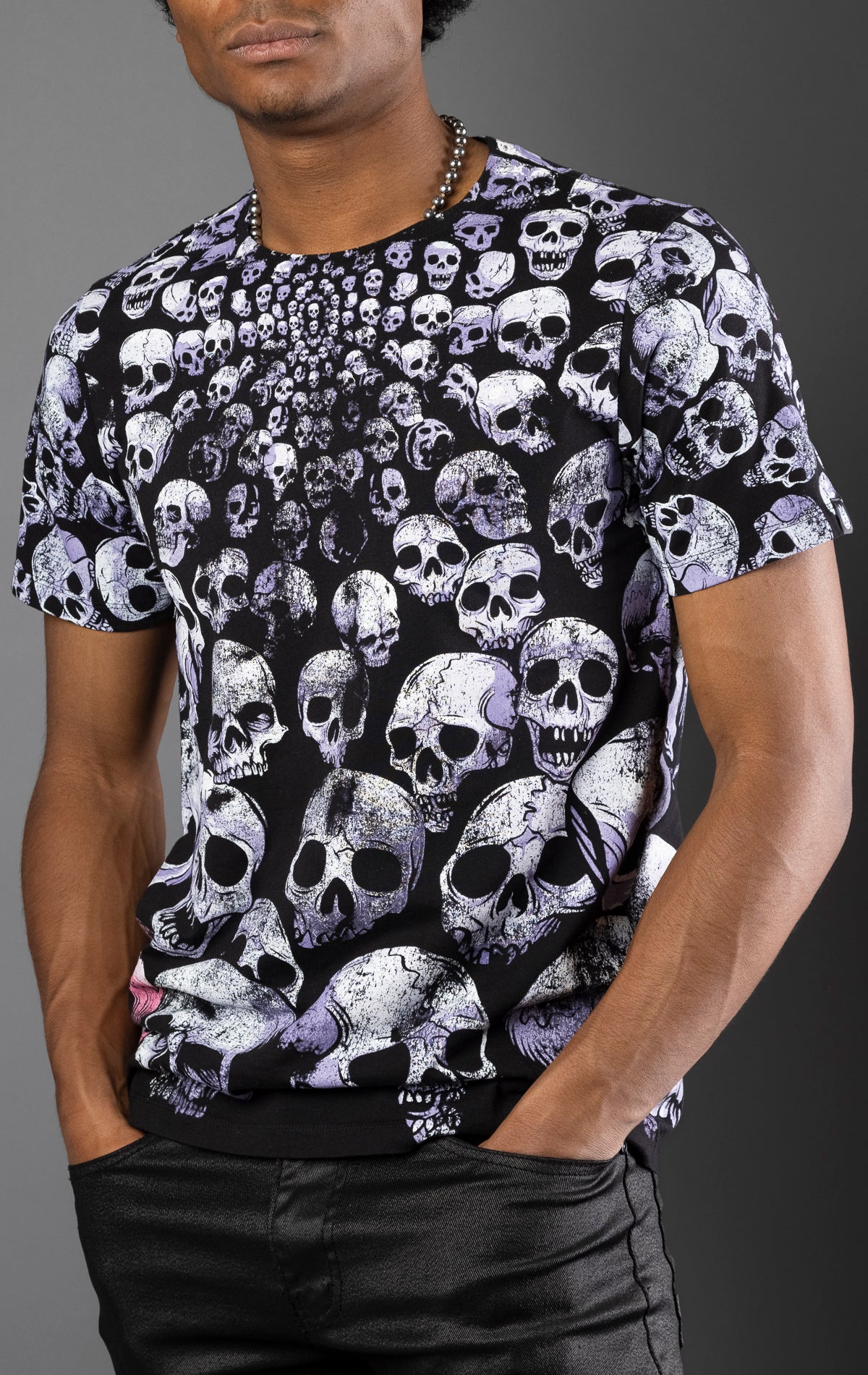 Black cotton tee with distressed all-over repeat skull print