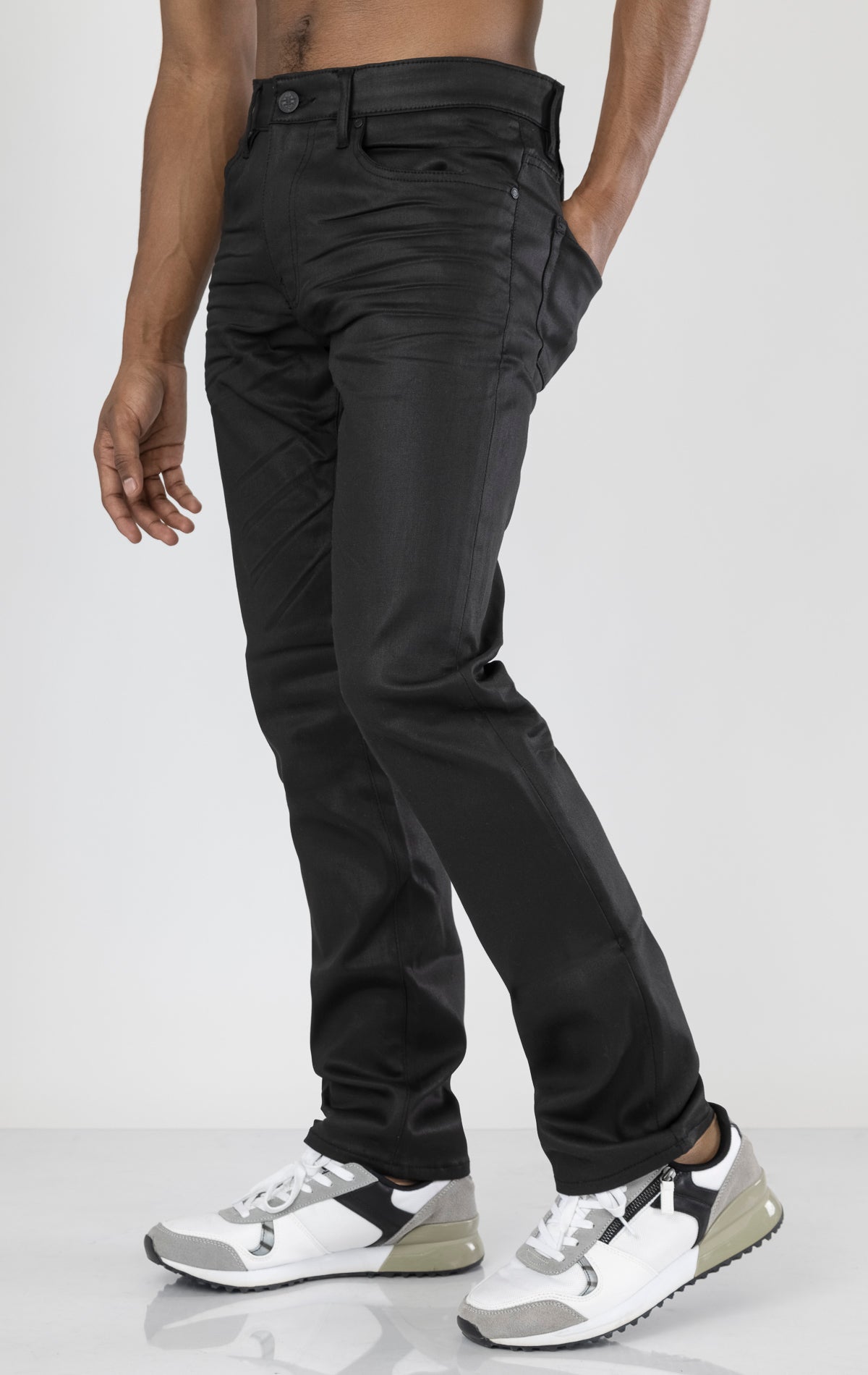 Men's black denim pants with a glossy coated finish. The pants feature a regular rise, straight leg fit, 3D hand-formed wrinkles for texture, and are made from a super stretch fabric blend (67% Modal, 29% Polyester and 4% Elastane).