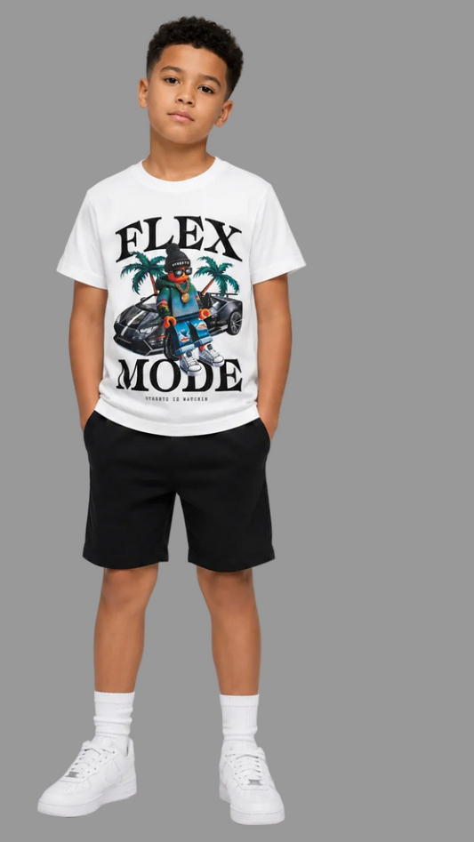 A child model shown from the front wearing a white short-sleeve graphic T-shirt with black shorts, white socks, and white sneakers against a light gray studio background.