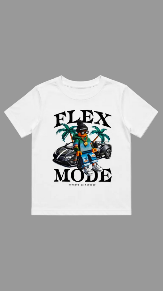 A white short-sleeve crewneck t-shirt with a colorful graphic print on the front. The graphic features the text 'FLEX MODE' in bold black letters, a cartoon character wearing sunglasses and a beanie, a black sports car, and two green palm trees.