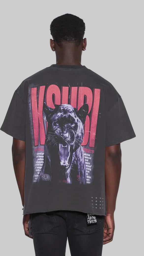 Person wearing a black t-shirt with a graphic design on the back, featuring a panther and text.