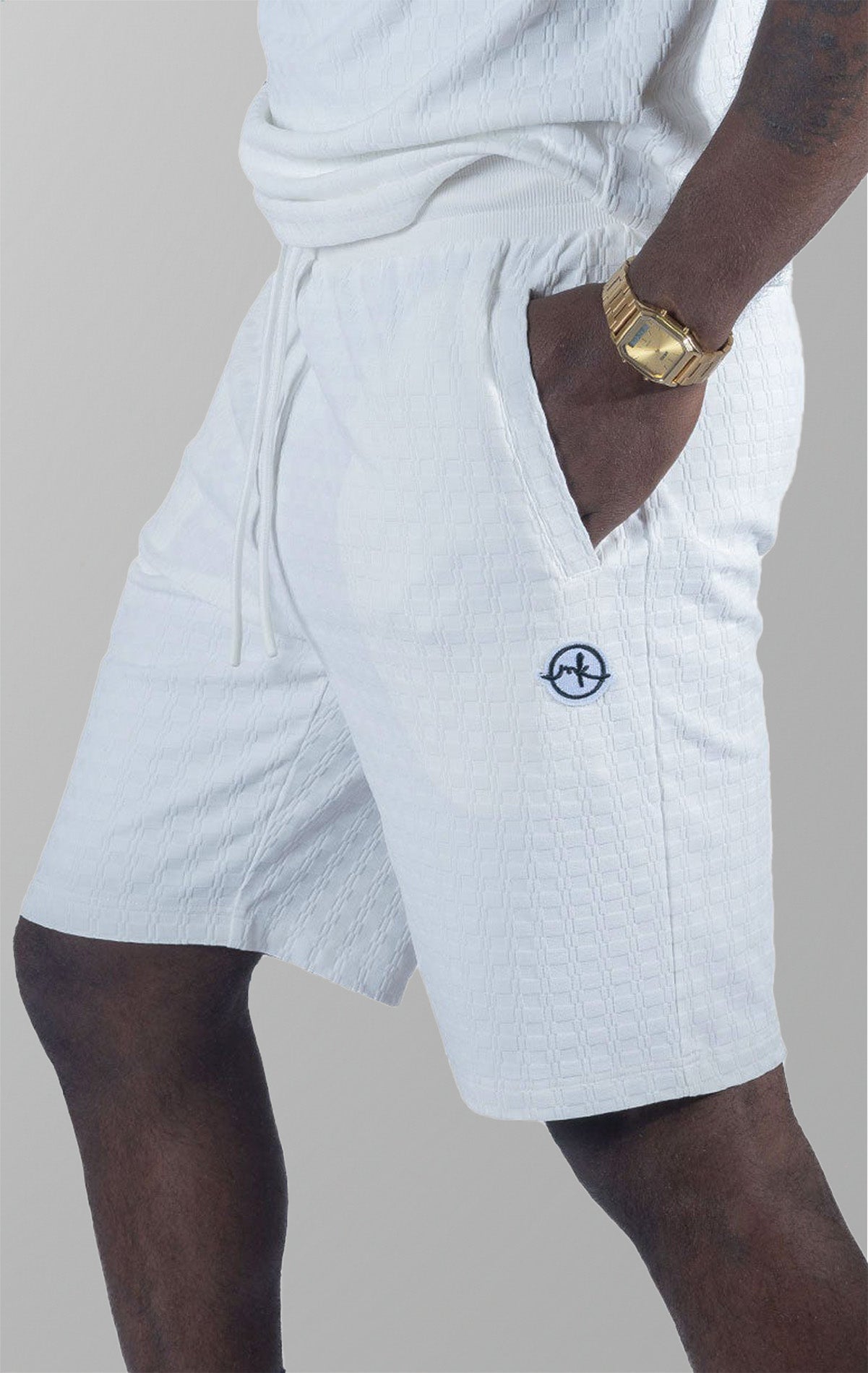 Modena Knit Shorts in white. Made from a high-quality blend of 95% cotton and 5% spandex for a soft and comfortable feel. Features a unique colored blocking design and a pre-shrunk true-to-size fit.