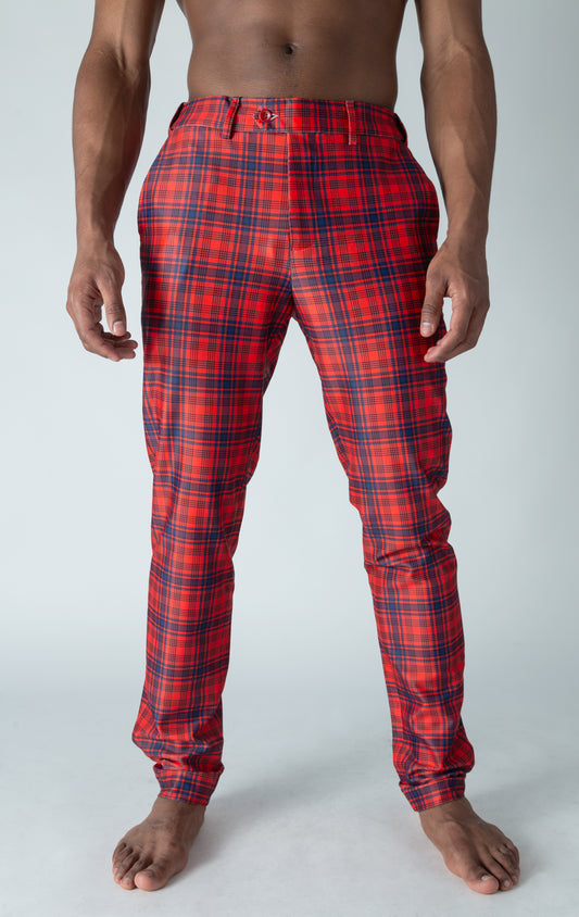 Men's red chino pants with a checkered plaid design. The pants feature an elastic waistband for comfort and stretch, and are made from a lightweight cotton-spandex blend fabric. Inseam is 32 inches.