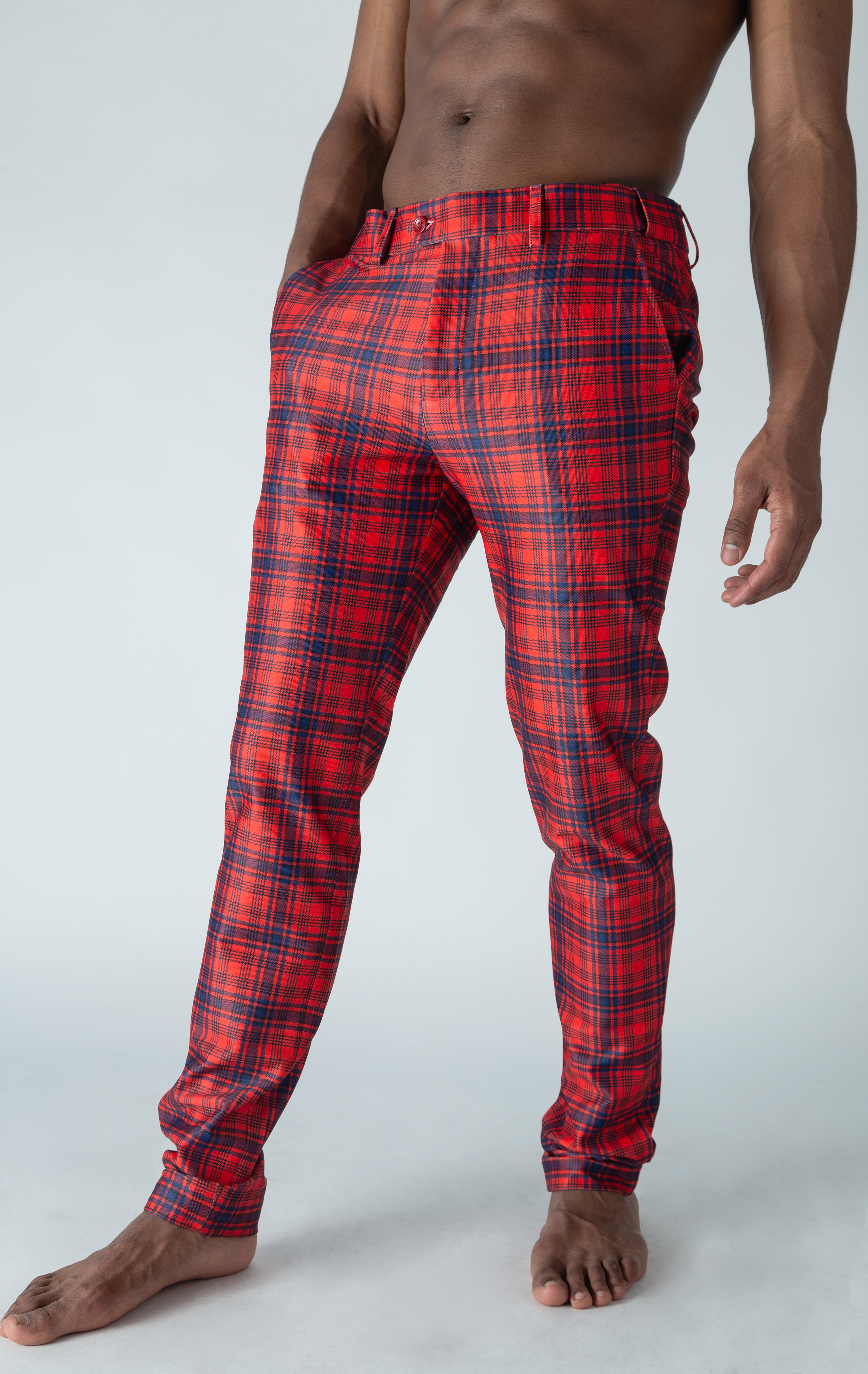 Men's red chino pants with a checkered plaid design. The pants feature an elastic waistband for comfort and stretch, and are made from a lightweight cotton-spandex blend fabric. Inseam is 32 inches.