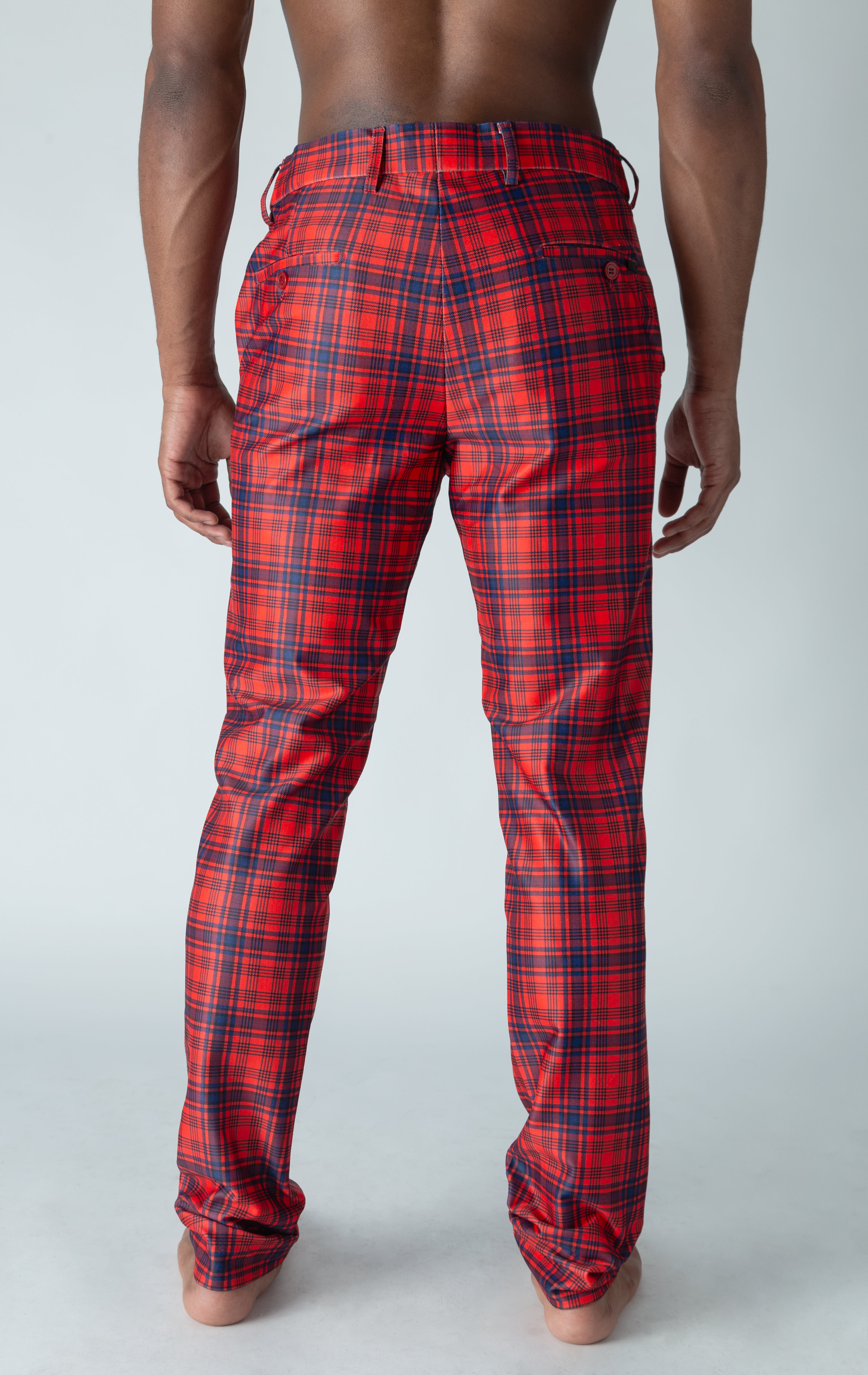 Men's red chino pants with a checkered plaid design. The pants feature an elastic waistband for comfort and stretch, and are made from a lightweight cotton-spandex blend fabric. Inseam is 32 inches.