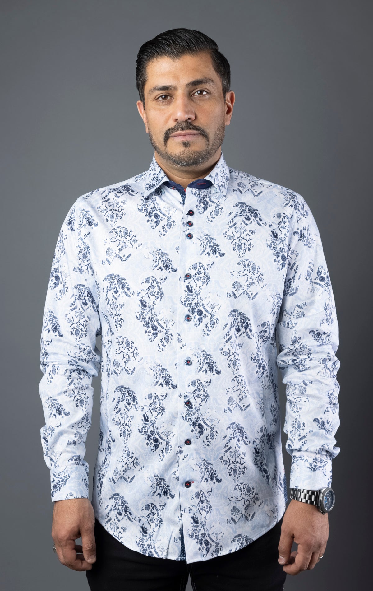 Men's casual dress shirt with 98% cotton and 2% spandex for optimum comfort, featuring contrasting patterns, sophisticated details, and Au Noir signature elements, including angled buttonhole, grouped buttons, embroidery detailing, and elegant ceramic button on the sleeve placket. Canadian owned and designed, machine washable, and modern-fit.