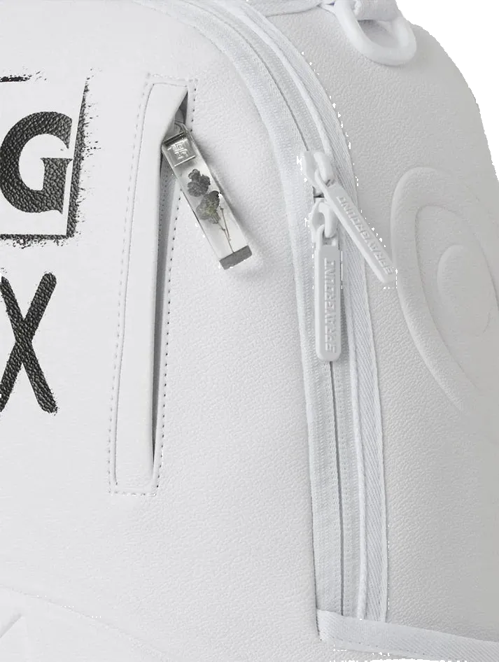 Close-up of a white textured backpack with black graphic lettering, a vertical zip pocket, and a clear zipper pull featuring a small figure.