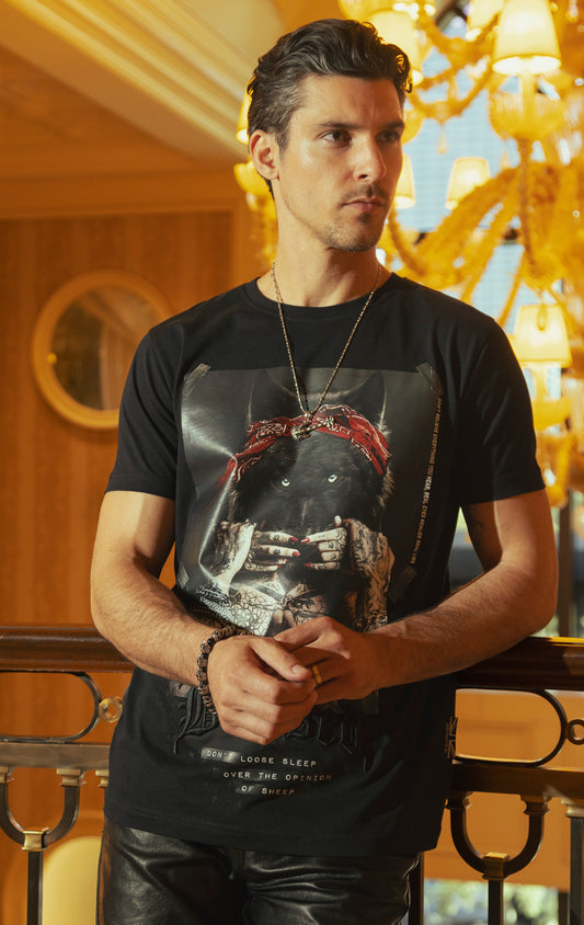 Blessed Inner Voice T-Shirt in black. Made from 100% cotton for a soft and breathable feel. Features a regular fit with slightly elongated fitted sleeves, a "don't loose sleep" message on the front, 3D self-colored "blessed" embroidery, and a woven "blessed" tab on the side seam.