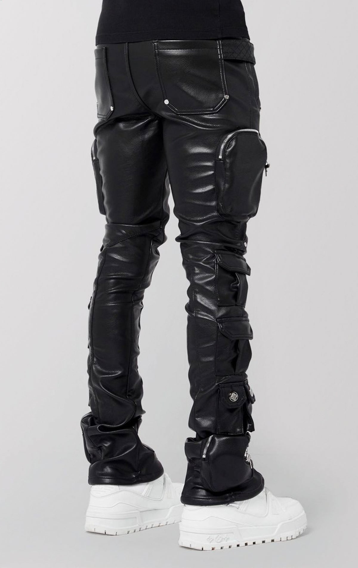 Slim-fit black faux leather cargo pants featuring 14 pockets, silver zippers, and quilted texture on the knees.