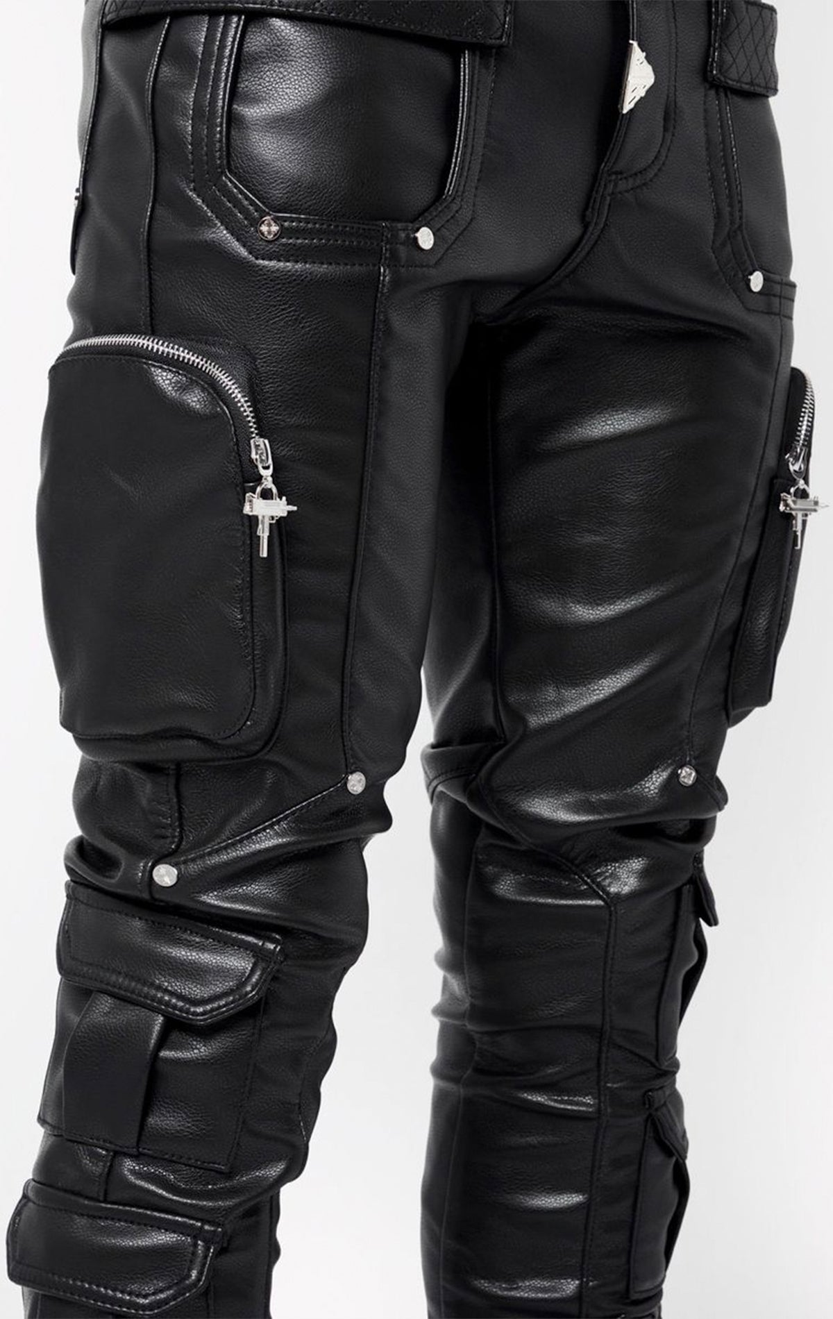 Black leather pants with zippers and buttons on a white background
