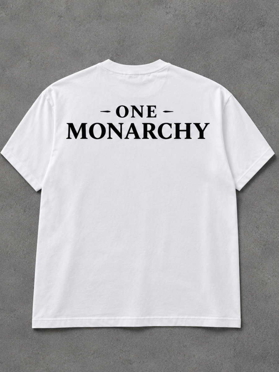 A white short-sleeve crewneck t-shirt with the text '- ONE - MONARCHY' printed in black across the upper back, laid flat on a textured gray background.