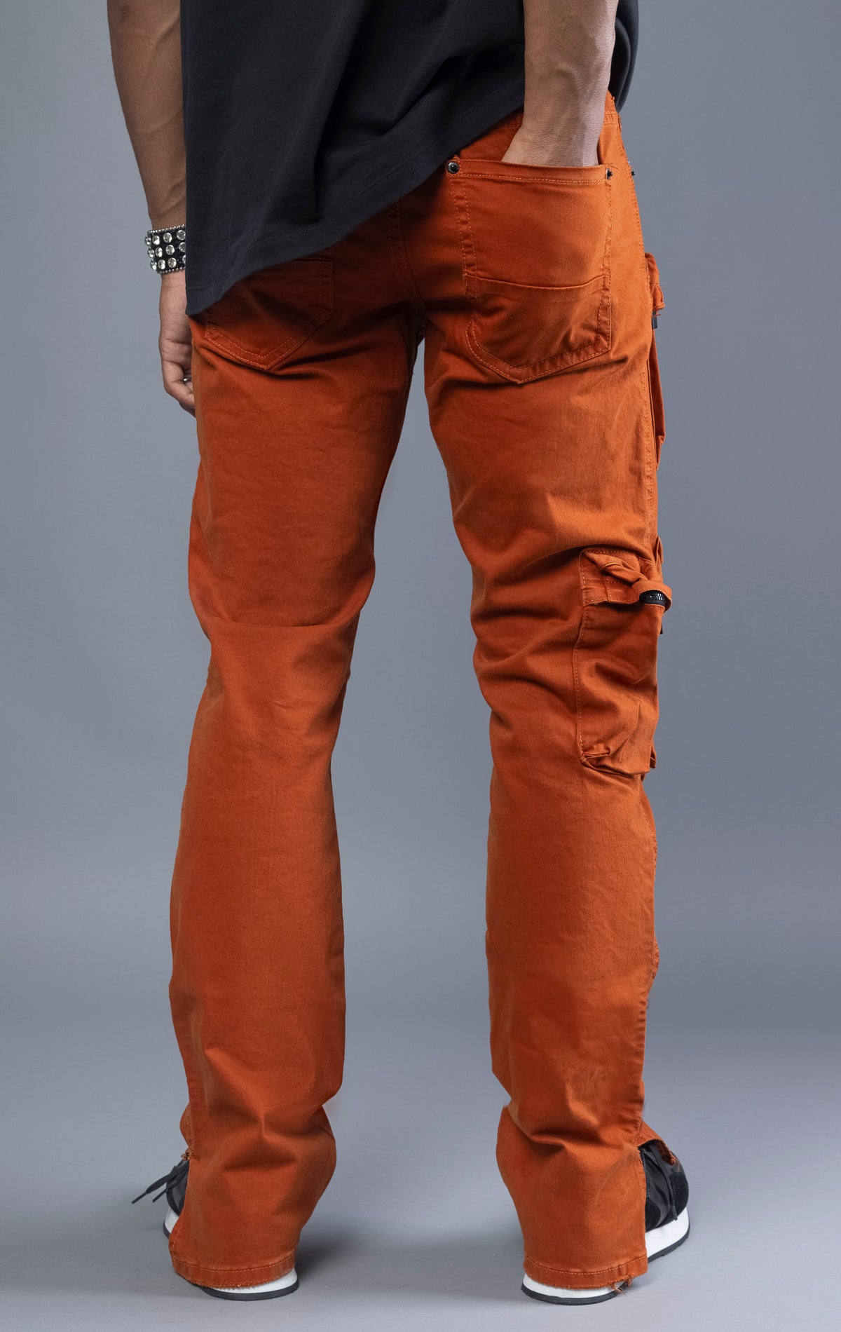 Men's cargo pants with multiple pockets for function. Regular, tapered fit with a comfortable rise. Available in orange and olive colors.