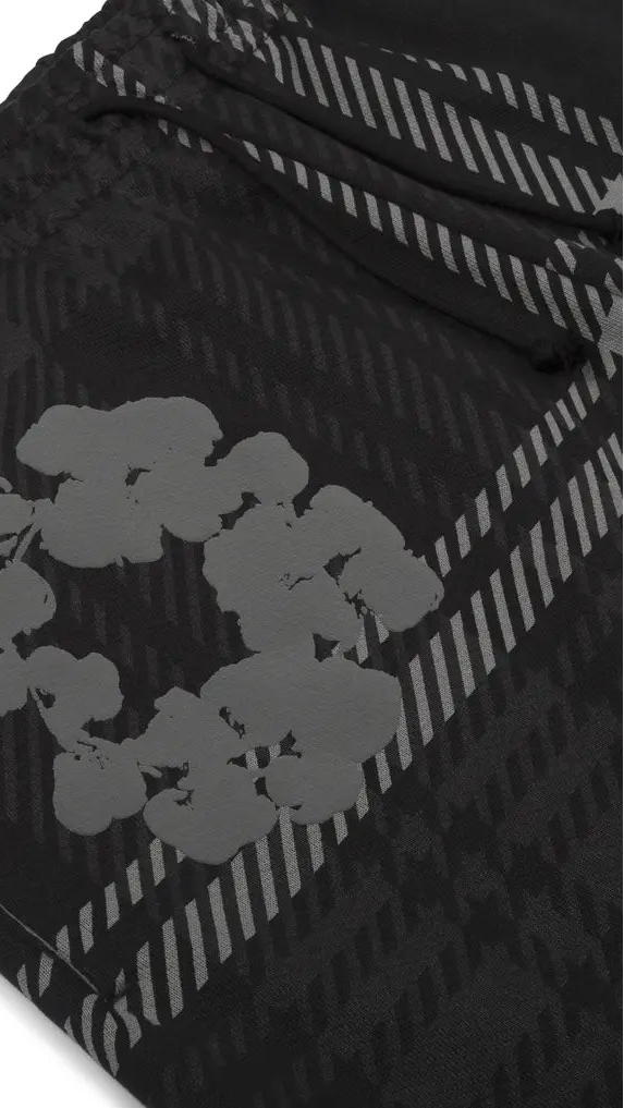 Black and gray patterned fabric with floral design on a white background
