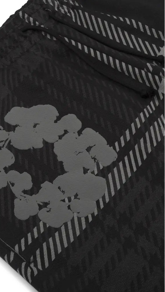 Black and gray patterned fabric with floral design on a white background