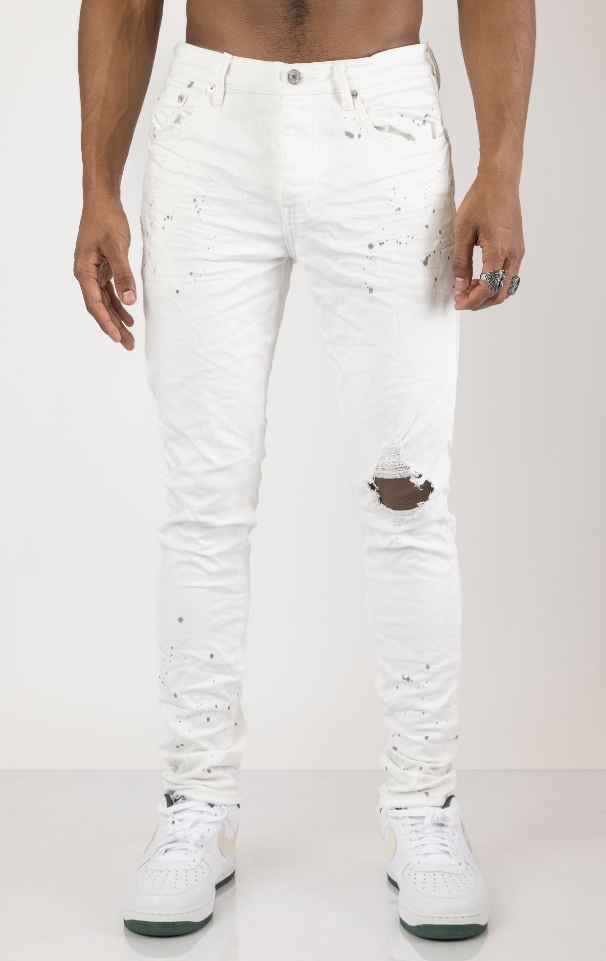 Unique jeans in dark wash (color may vary). Made from 98% cotton and 2% lycra for comfort. Features include a signature purple hangtag, lined back pockets and yoke for comfort and shape retention, reinforced belt loops, hidden back pocket rivets, and a classic button fly closure.