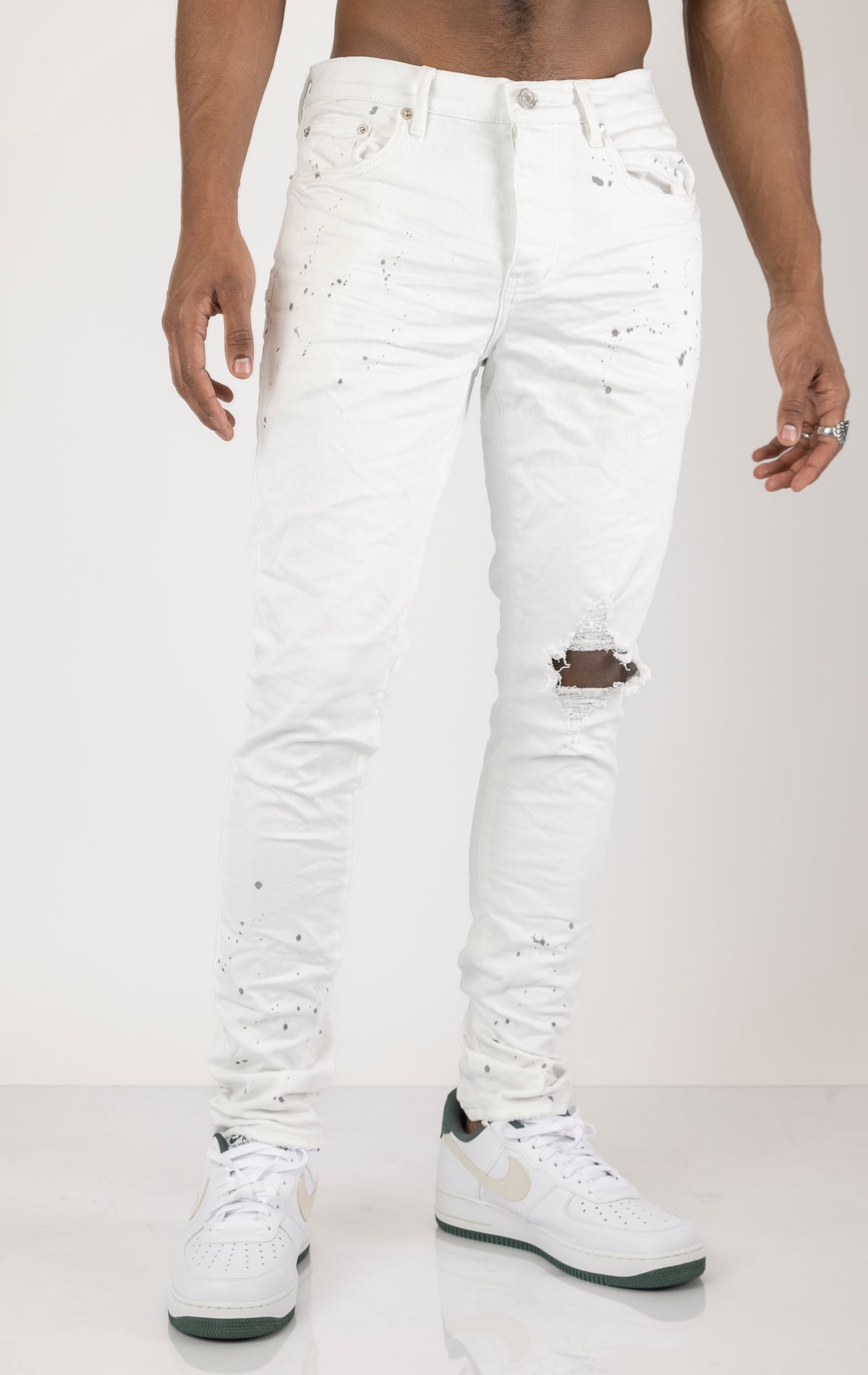 Unique jeans in dark wash (color may vary). Made from 98% cotton and 2% lycra for comfort. Features include a signature purple hangtag, lined back pockets and yoke for comfort and shape retention, reinforced belt loops, hidden back pocket rivets, and a classic button fly closure. 