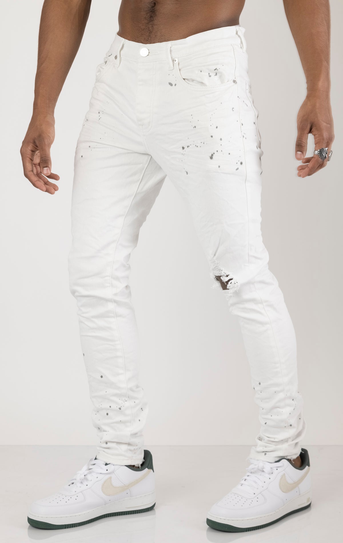 Unique jeans in dark wash (color may vary). Made from 98% cotton and 2% lycra for comfort. Features include a signature purple hangtag, lined back pockets and yoke for comfort and shape retention, reinforced belt loops, hidden back pocket rivets, and a classic button fly closure.