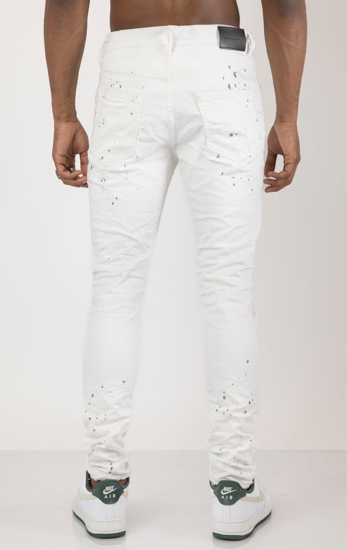 Unique jeans in dark wash (color may vary). Made from 98% cotton and 2% lycra for comfort. Features include a signature purple hangtag, lined back pockets and yoke for comfort and shape retention, reinforced belt loops, hidden back pocket rivets, and a classic button fly closure.