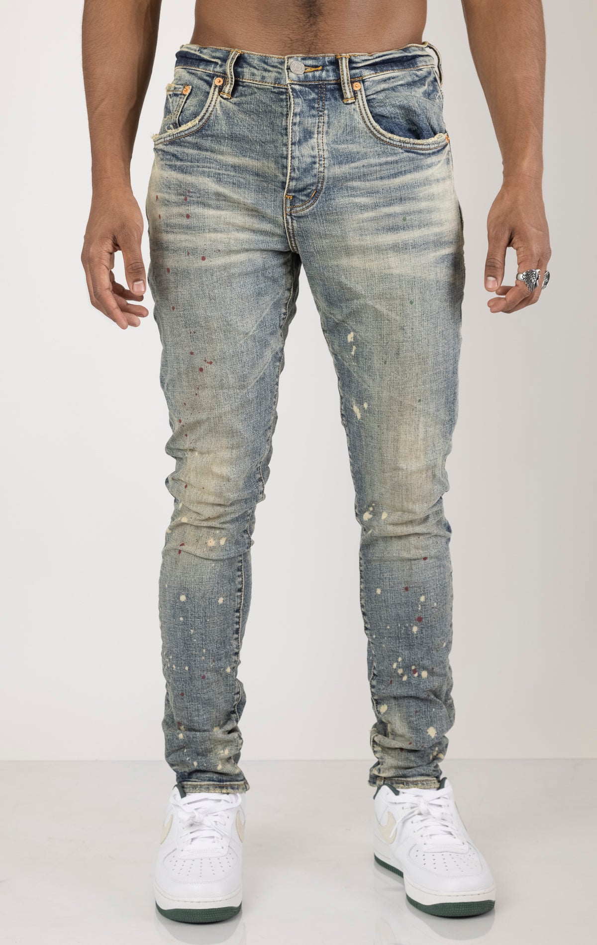 Vintage Spotted Indigo Jeans in dark wash with subtle lighter colored spots. Made from 98% cotton and 2% elastane for comfort. Features include lined back pockets and yoke for comfort and shape retention, reinforced belt loops, and hidden back pocket rivets.