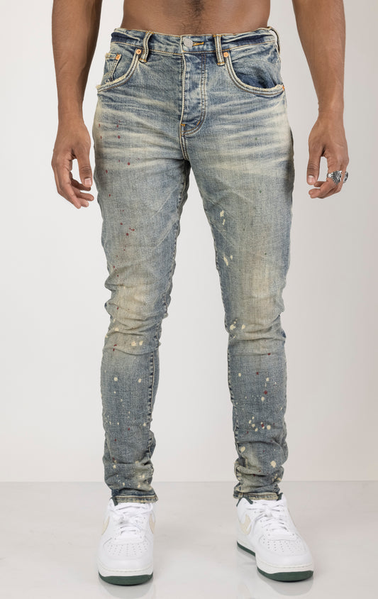 Vintage Spotted Indigo Jeans in dark wash with subtle lighter colored spots. Made from 98% cotton and 2% elastane for comfort. Features include lined back pockets and yoke for comfort and shape retention, reinforced belt loops, and hidden back pocket rivets.