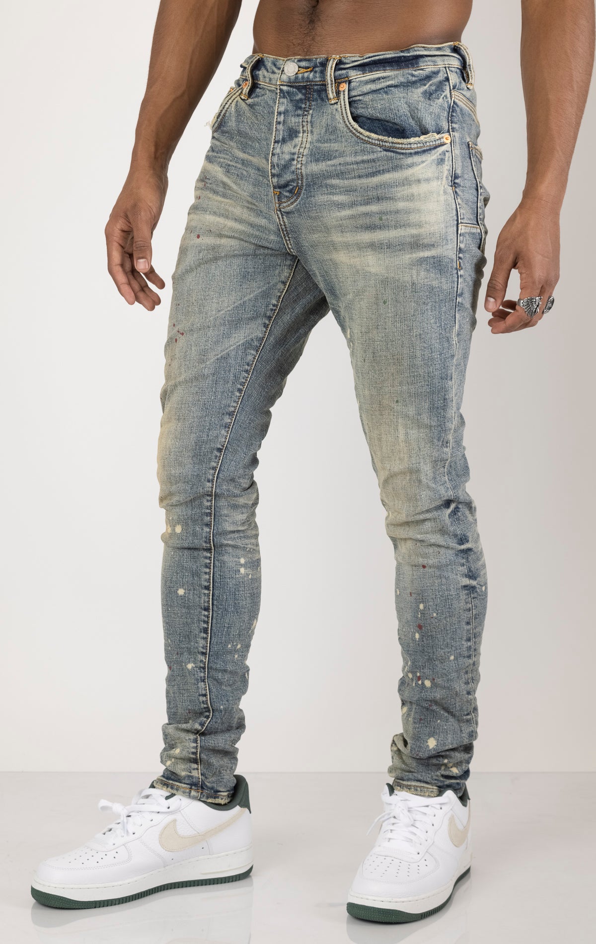 Vintage Spotted Indigo Jeans in dark wash with subtle lighter colored spots. Made from 98% cotton and 2% elastane for comfort. Features include lined back pockets and yoke for comfort and shape retention, reinforced belt loops, and hidden back pocket rivets.