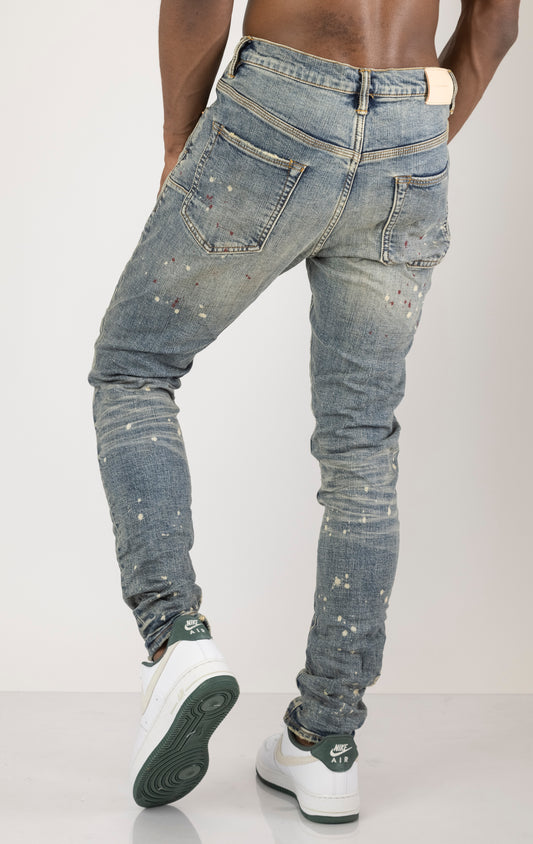 Vintage Spotted Indigo Jeans in dark wash with subtle lighter colored spots. Made from 98% cotton and 2% elastane for comfort. Features include lined back pockets and yoke for comfort and shape retention, reinforced belt loops, and hidden back pocket rivets.