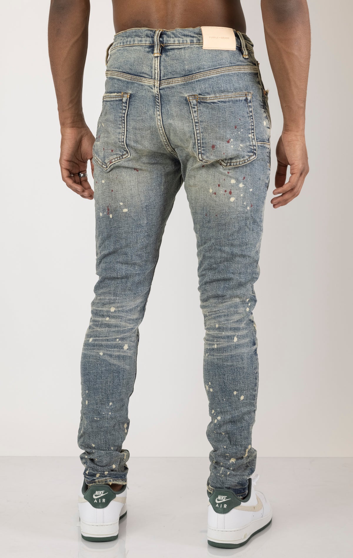 Vintage Spotted Indigo Jeans in dark wash with subtle lighter colored spots. Made from 98% cotton and 2% elastane for comfort. Features include lined back pockets and yoke for comfort and shape retention, reinforced belt loops, and hidden back pocket rivets.
