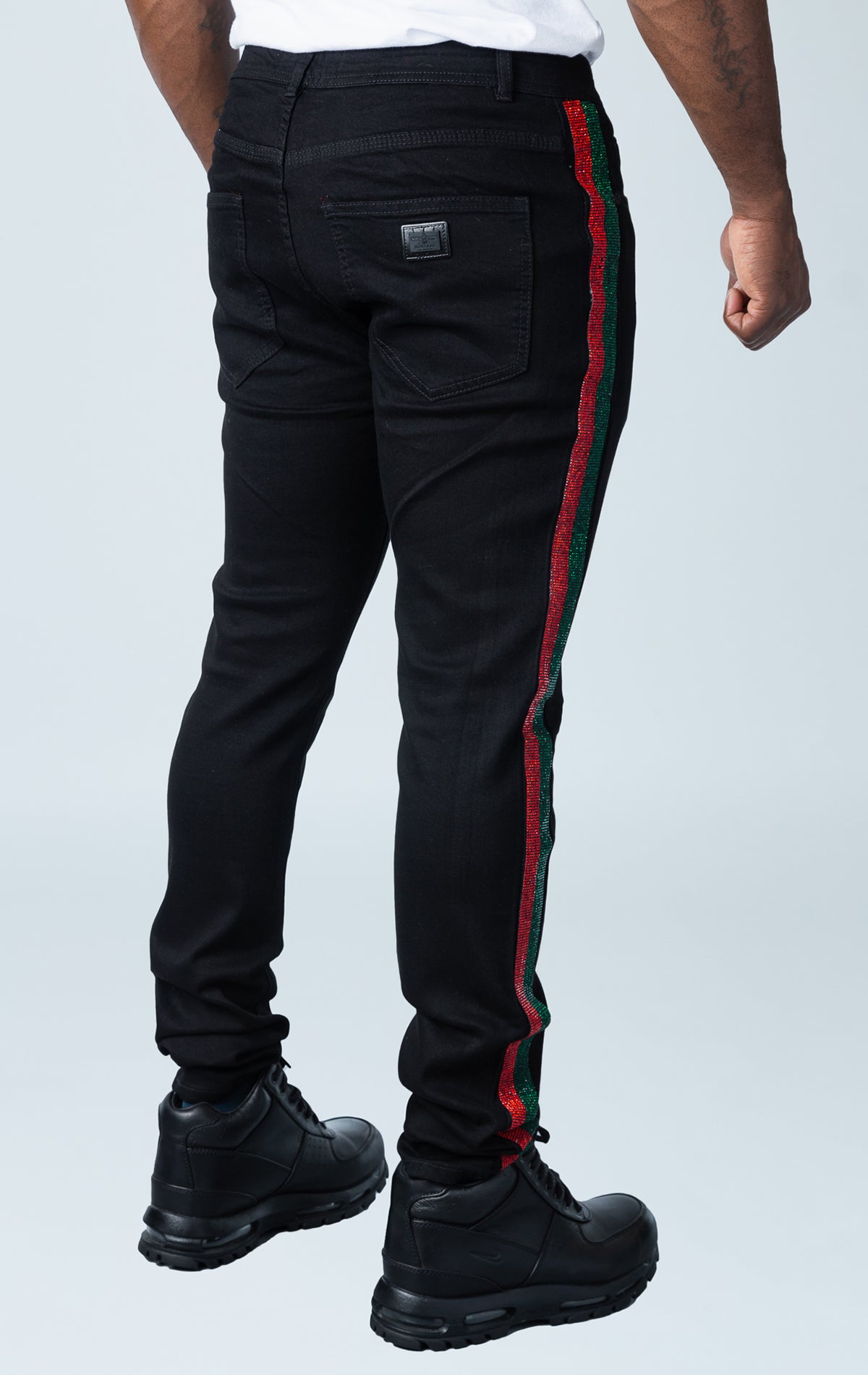 Men's green and red rhinestone jeans with slim fit and hand-placed rhinestone side lines.