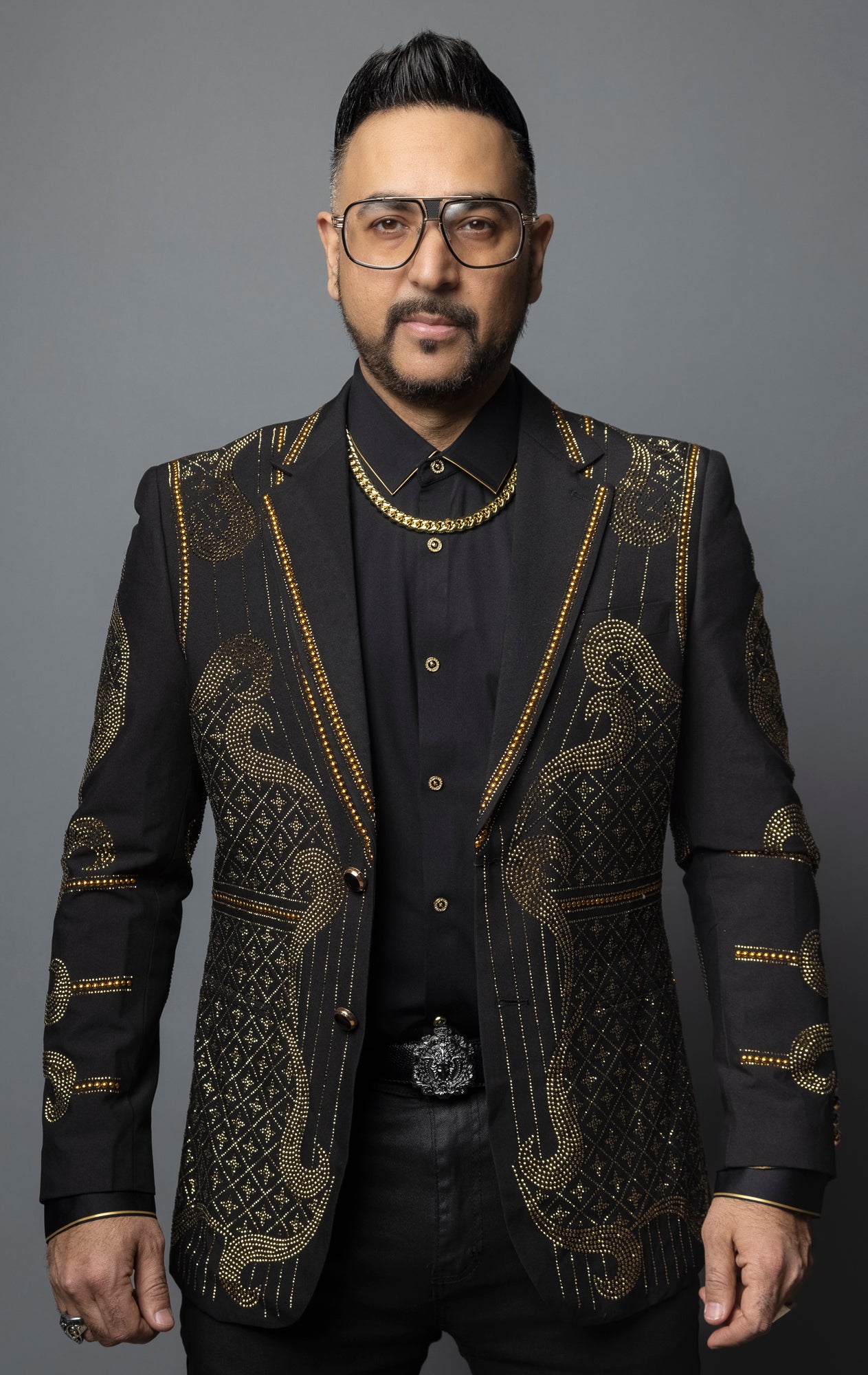 Embellished blazer with intricate details and tailored silhouette for special occasions.